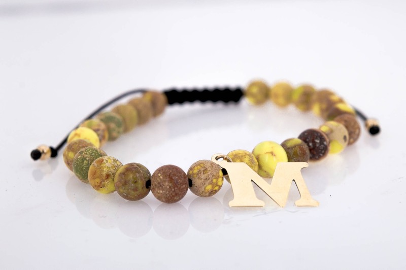 Bransoletka na rękę z kamieniami i złotem.jpg