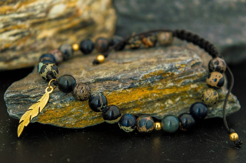 bransoletka złote pióro z kamieniami.jpg