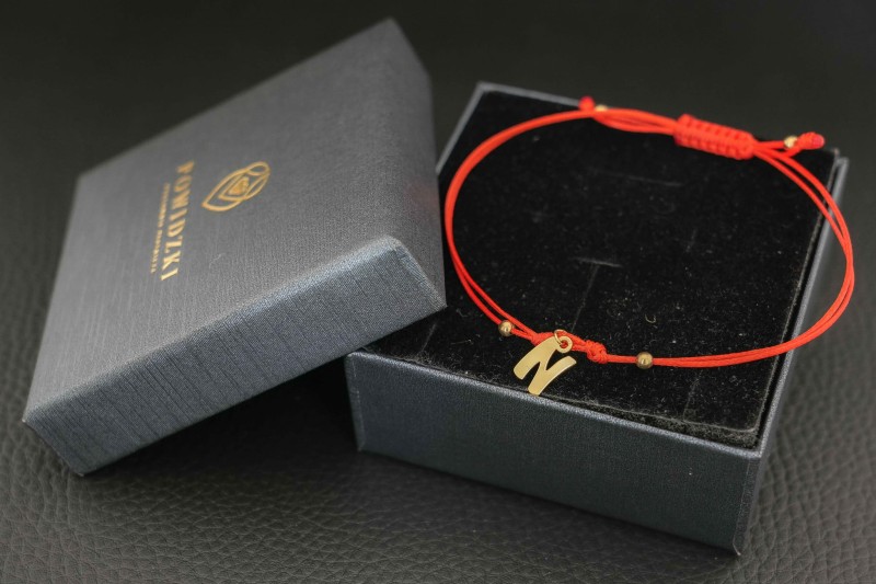 bransoletka złota literka sznurek.jpg